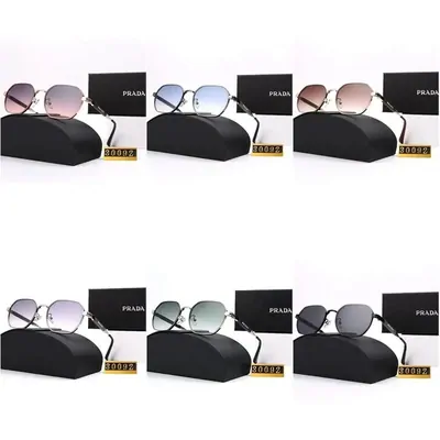 Six pairs of sunglasses shown with their cases in two rows on white