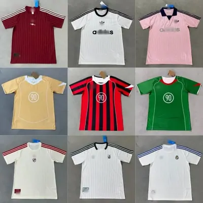 Nine football shirts in different colours arranged in a three by three grid