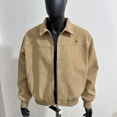 A tan cotton jacket with a collar and press-stud front shown on a headless mannequin